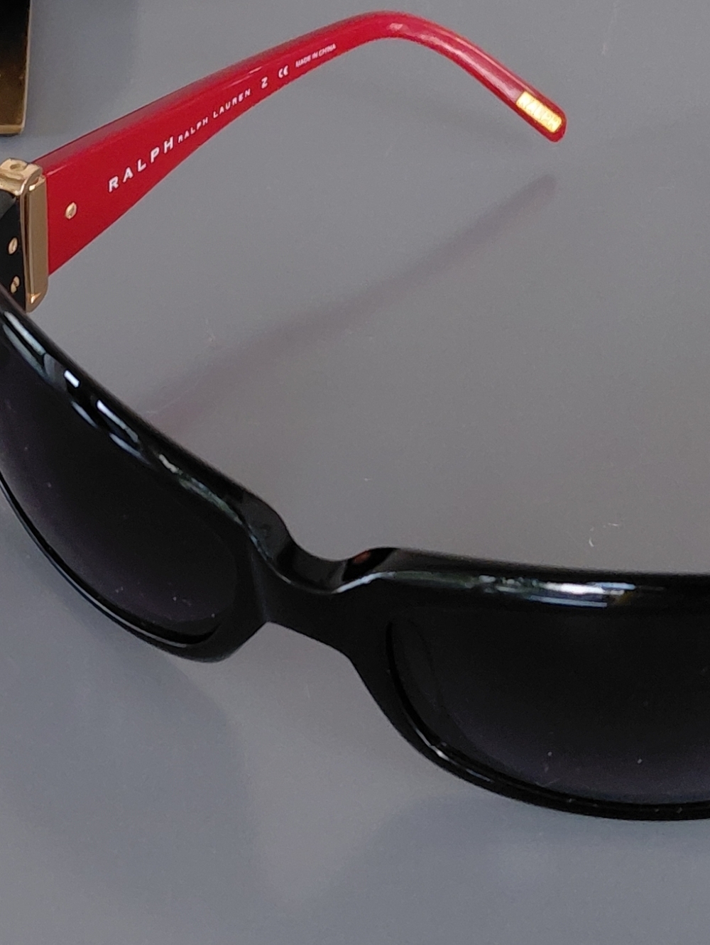 Ralph Lauren Black Frame Sunglasses with Red Temples